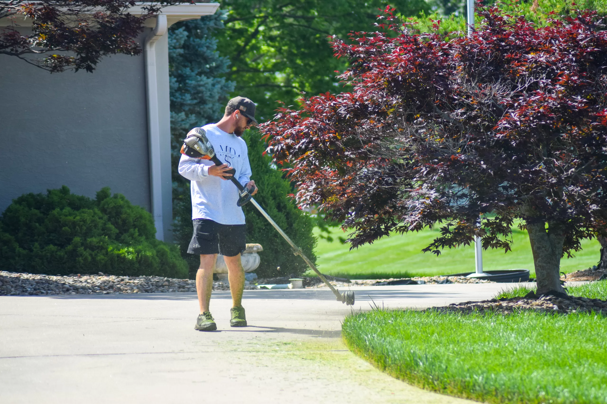 Michael Trimming Lawn